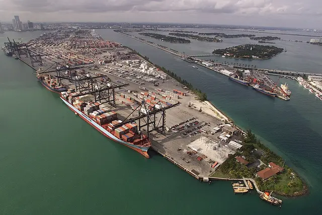 Container port with cranes and a cargo ship